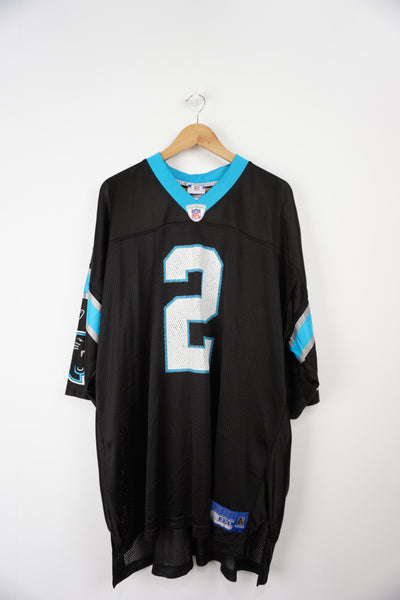 Carolina Panthers #2 Jimmy Clausen NFL Reebok Home Jersey. Printed Logos and number on front and back. Jersey colour Black Jersey in good condition, cracking on lettering front/back Size in Label: XXXL