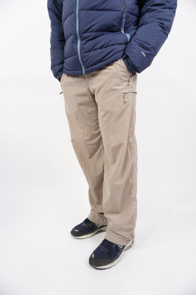 Stone grey The North Face tech trousers with zip up pockets and elasticated waistband