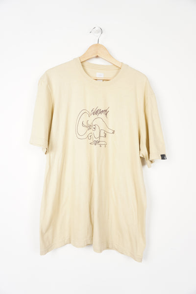 Light tan Adidas t-shirt with embroidered lettering and elephant graphic