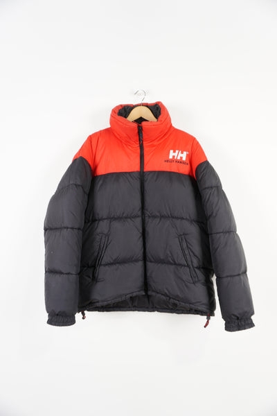 Black and red Helly Hansen puffer jacket with multiple pockets, drawstring hem and embroidered spell-out logos on front and back