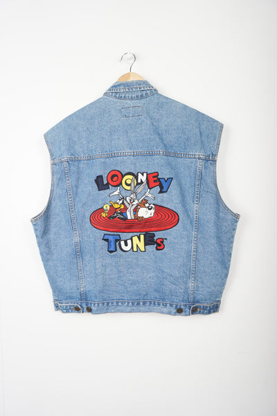 This 90s Warner Bros Looney Tunes denim vest features a classic design with embroidered characters and logo.