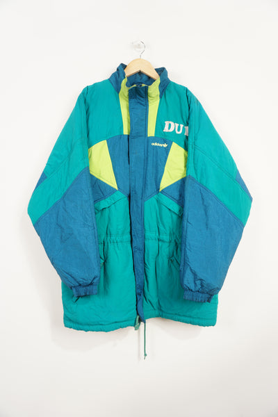 Vintage 80's green and blue Adidas padded sports coat, with embroidered logo on the chest. "Dulph Park Rangers" raised lettering on front/back good condition, discolouring on lettering and marks on left shoulder (see pictures) Size in Label: L