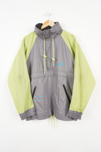 Grey and neon yellow puma high performance activity wear pull over 1/2 zip lightweight jacket with hood