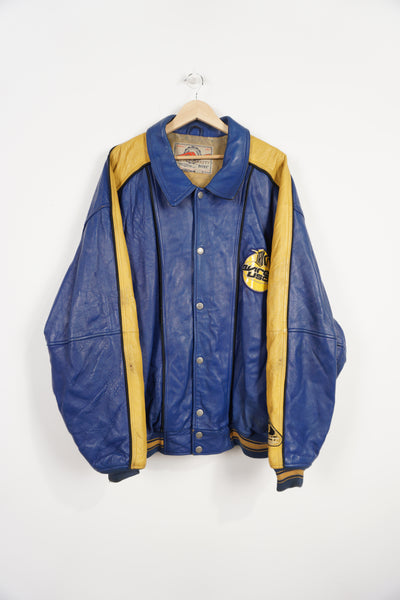 Vintage Avirex USA Slam Dunk 05 blue and yellow leather varsity jacket with embroidered patches on the front and back 