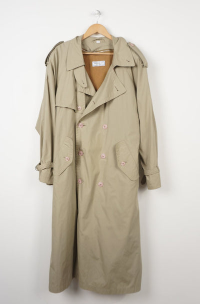YSL trench coat features a button-up closure along with a lining and belt.
