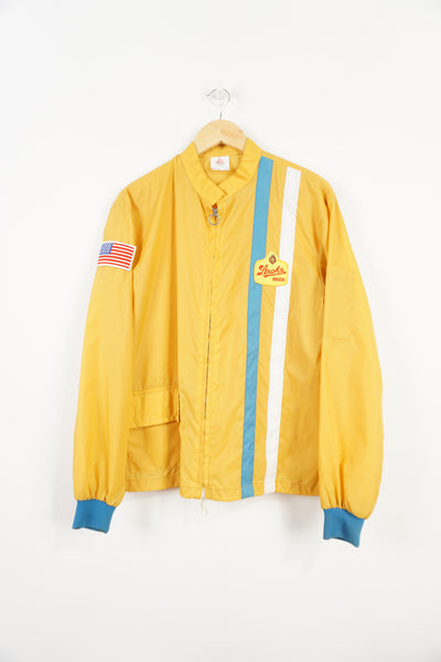 Vintage 1970's 'The Great Lakes Jacket' yellow zip through track style jacket with embroidered badges on the chest and sleeve
