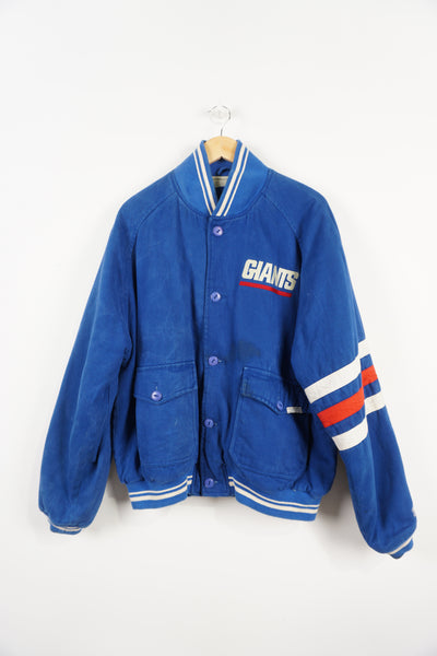 Vintage 1995 New York Giants cotton bomber Jacket. Embroidered name on front and logo on back. Fair Condition, signs of wear due to age, discolouring on team name and dark mark near front pockets (see pictures) Size in Label: L 