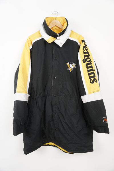 Vintage 90's Pittsburgh Penguins bench coat with embroidered details on the sleeves and chest