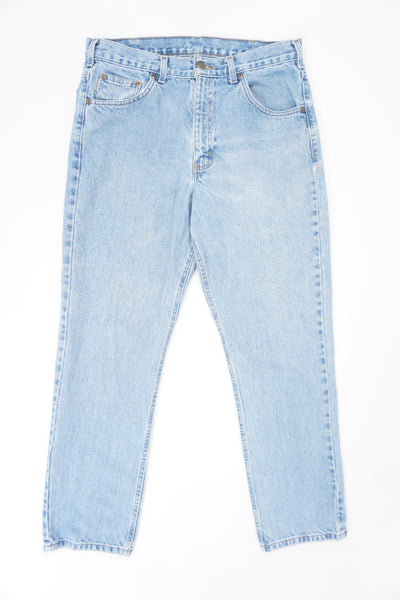 Carhartt traditional fit light blue denim jeans with signature leather logo on the back pocket