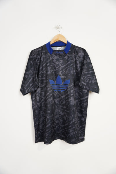 Vintage Adidas plain black football style shirt with raised blue adidas logo 