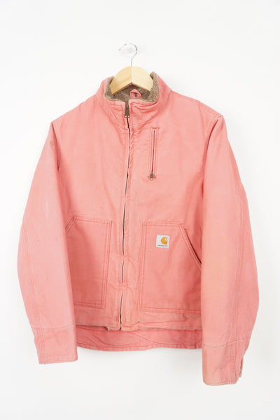 Pink Carhartt zip through workwear jacket with sherpa fleece lining and logo on the pocket