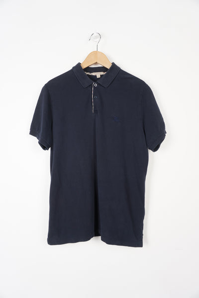 Navy blue Burberry polo shirt with embroidered logo on the chest