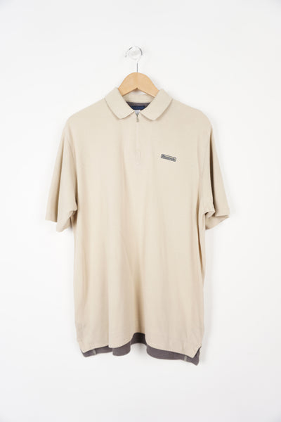 Reebok beige polo shirt with embroidered logo on the chest and 1/4 zip detail