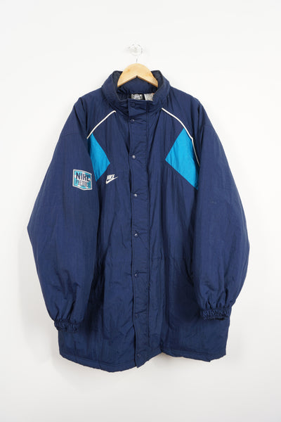 Vintage Nike Premier navy blue zip through sports coat, with embroidered swoosh logo on the front and back