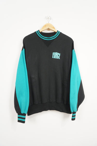 Vintage 1980s Nike Force black sweatshirt with turquoise embroidered logos and details