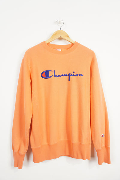 Champion Reverse weave orange spellout Sweatshirt, embroidered logo across chest and small logo on sleeve good condition, small white mark on collar Size in Label: L