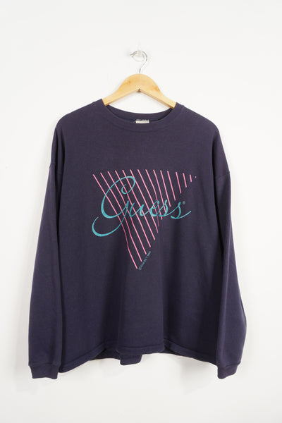 Vintage 1989 Guess purple crewneck sweatshirt with spell-out graphic on the front