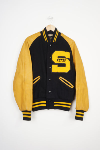 Vintage Whiting navy wool letterman jacket with yellow leather sleeves and embroidered details 