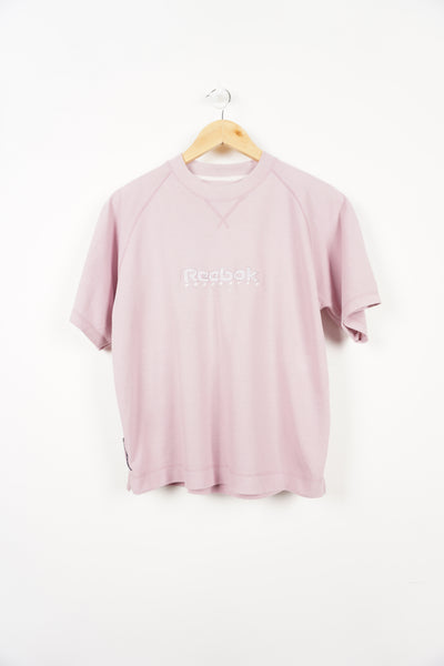 Vintage 00's pink Reebok Freestyle tee with embroidered spell-out logo on the front