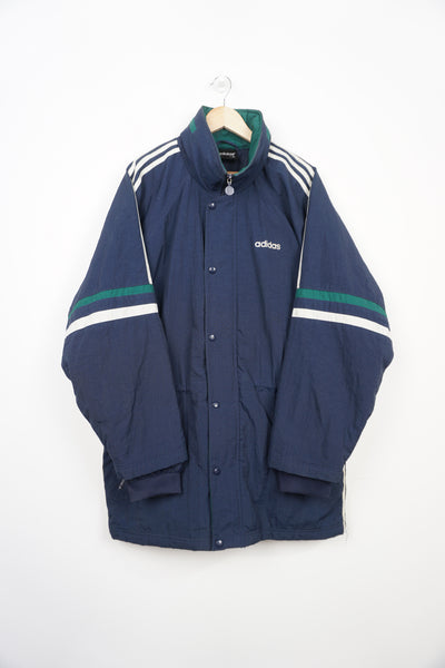 Vintage navy blue padded sports coat, with embroidered logo on the chest, three stripes and foldaway hood