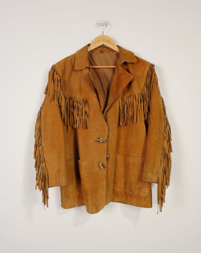Vintage tan suede leather jacket with fringe details on the front and down both sleeves
