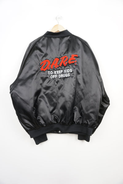Vintage 1990's D.A.R.E black satin bomber jacket with embroidered lettering on the front and back 
