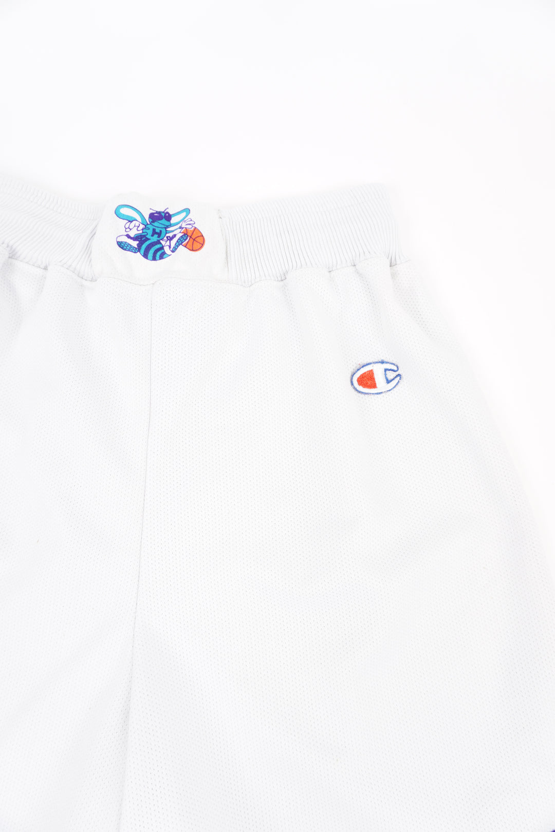 Vintage 90s Charlotte Hornets Champion basketball shorts with embroidered details