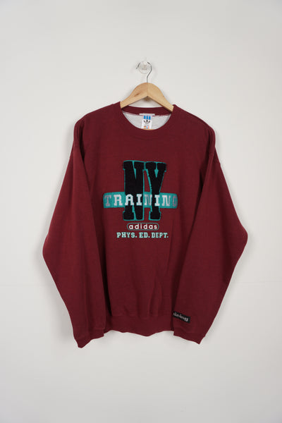 Vintage 90's Adidas burgundy crew neck sweatshirt, with 'New York Training Phys. Ed. Dept' embroidered motif on the front 