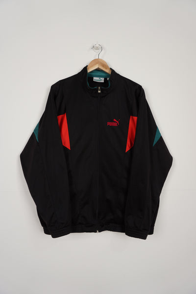 Vintage black Puma zip through tracksuit jacket with embroidered logo 