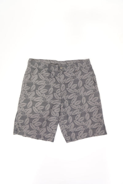 Grey Dickies shorts with logo on back pocket. Features a surfer style leaf print in a lighter grey.