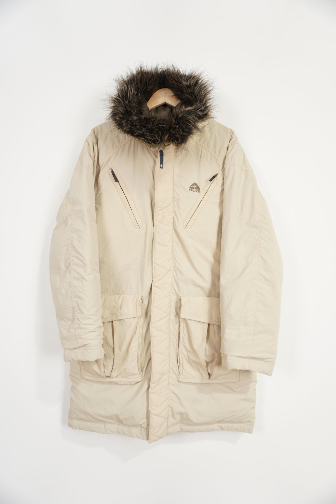 Nike ACG zip through coat with high neck, pockets and faux fur on collar