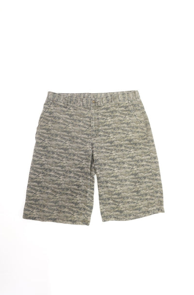 Green Dickies shorts with logo on the back pocket. Features a abstract palm print/ camo pattern throughout. 