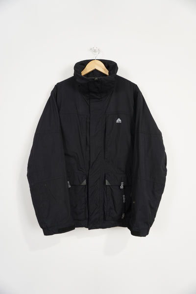 Nike ACG zip through black waterproof jacket with high neck and pockets