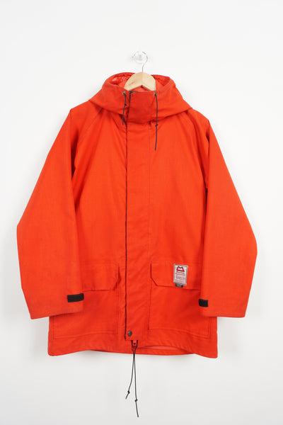 Vintage Mountain Equipment red Gortex jacket with popper closures and embroidered logo on the pocket