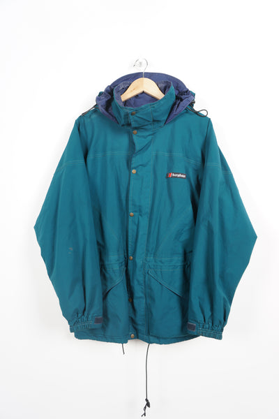 Vintage Dark Green Berghaus 'Glissade I.A' Gore-Tex waterproof jacket with hood, embroidered logo and drawstring fastening, metal buttons with brand detailing good condition: small hole on right sleeve near cuff 