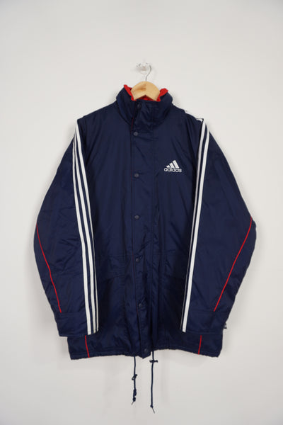 Vintage 90's navy blue Adidas padded sports coat, with embroidered logo on the chest, three stripes down the sleeve and foldaway hood