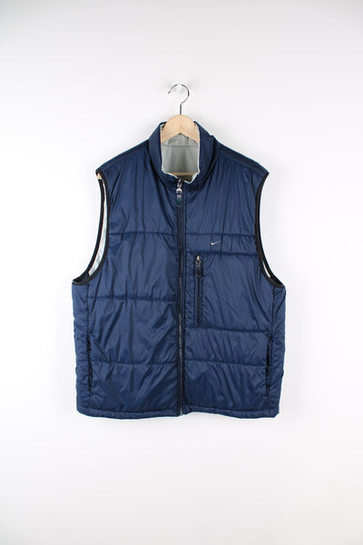 Vintage Nike reversible light puffer vest in blue and grey.