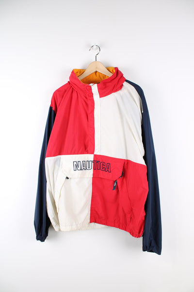 Vintage Nautica pullover half zip jacket. Features pouch pocket, embroidered logo, and red, white and blue panelling.