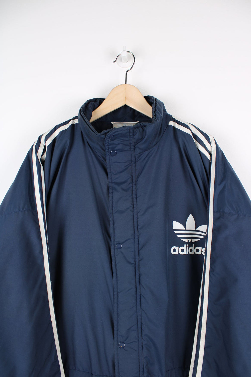 Blue Adidas coat featuring classic 3 stripes down the sleeves and printed logo on the chest and the back.
