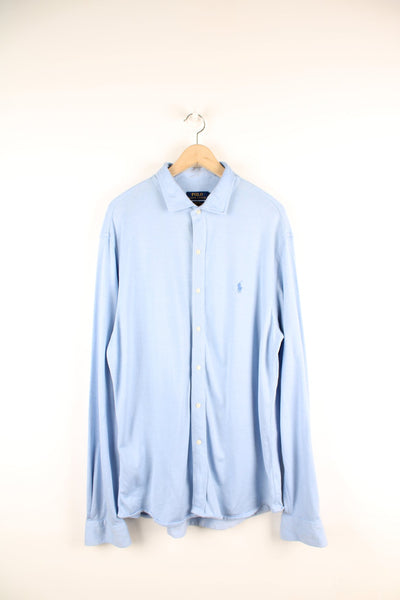 Ralph Lauren blue knit dress button up shirt with embroidered logo on the chest.