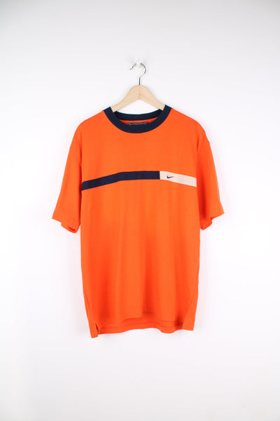 Orange Nike T-Shirt with embroidered logo and blue panel feature across the chest.