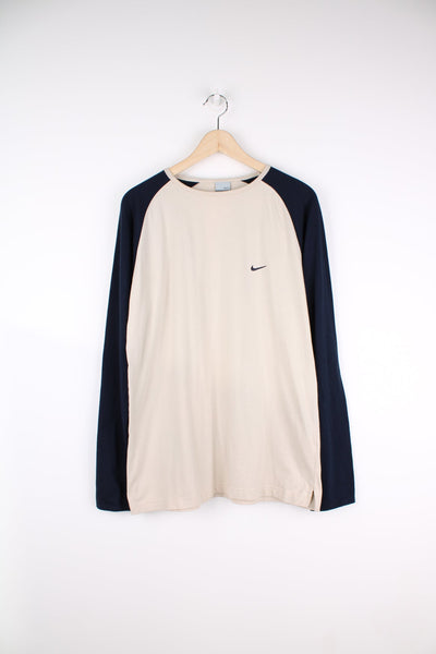 Nike navy and beige long sleeve T-Shirt with embroidered logo on the chest.