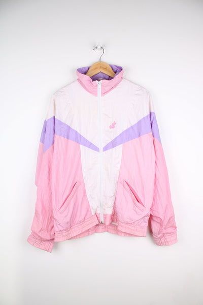 Vintage Hi-Tec shell tracksuit top in white, purple and pink. Features embroidered logo on the chest.