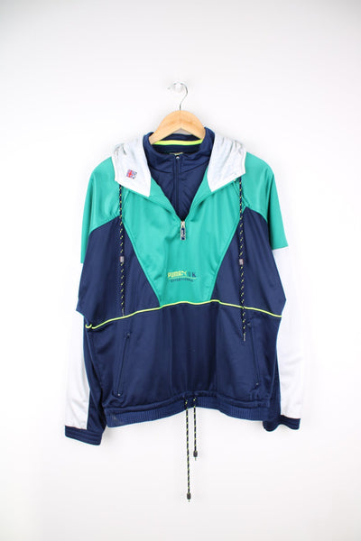 Puma pullover tracksuit top in blue, green and white with quarter zip. Features embroidered logo on the chest and back.