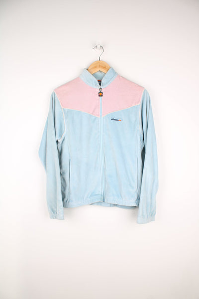 Vintage Ellesse velour tracksuit top in blue and pink. Features embroidered logo on the chest.