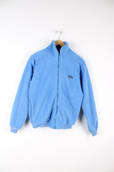 Blue Vintage 80s Patagonia zip through fleece with embroidered logo on the chest.
