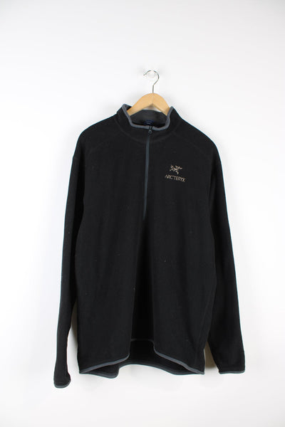 Arcteryx black waffle fleece with half zip. Features embroidered logo on the chest.