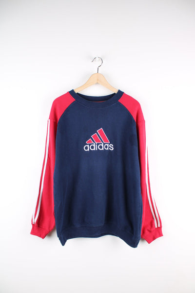 Blue and red Adidas sweatshirt with embroidered logo across the chest.