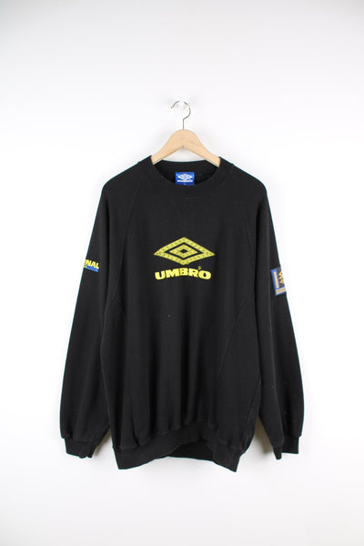 Vintage black Umbro sweatshirt with yellow embroidered logo across the chest and back.