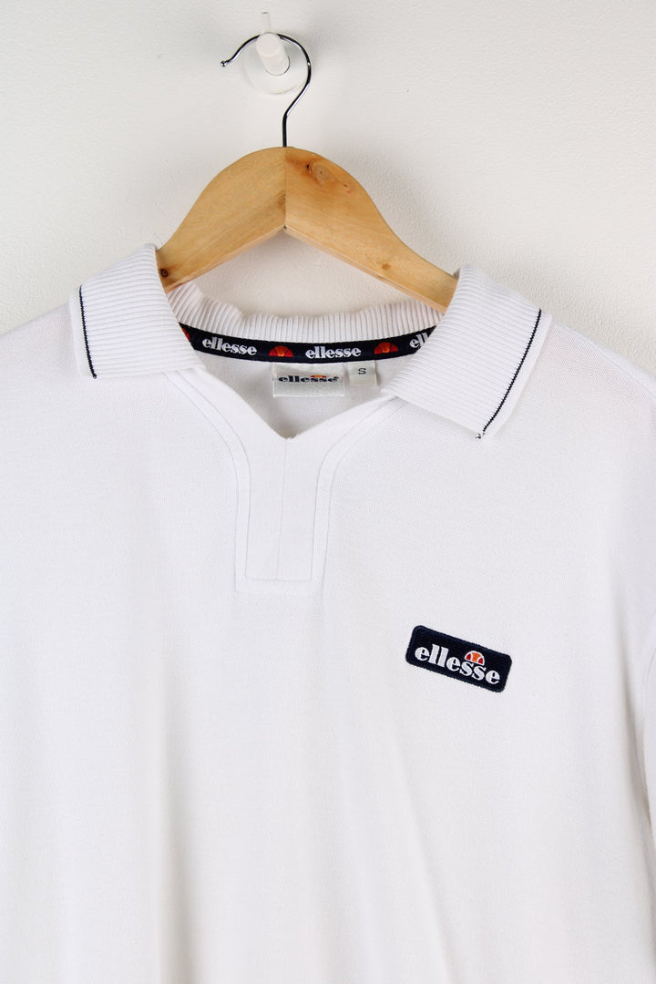 White Ellesse polo shirt with embroidered logo on the chest.